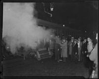 Detective Lieutenant Jack A. Stambler uses tear gas against Los Angeles Railway strikers, Los Angeles, 1934