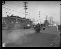 Police officer follows Hayward Thompson as he drives through traffic, Los Angeles, 1927