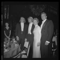 Otis Chandler (right) with sons, including Norman Brant Chandler (2nd from left), and wife, Marylin Brant at the Las Madrinas Ball, 1973