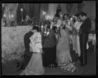 Mourners pray at a temporary altar at the Olvera Street memorial service for Harry Carr, Los Angeles, 1936