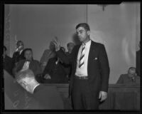 Police officer A. H. Hamilton raises his hand to speak, Los Angeles, 1935