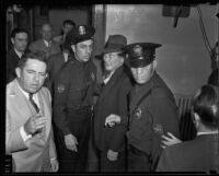 Eugene Kent, President of Glendale Protective Association, led by police, Glendale, 1935