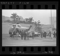 President Johnson and Lynda Bird exit helicopter in parking lot at Century Plaza. B. 1967