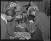 Deputy Sherriff Tom Humphries, Investigator Joe MacDonald, Basil C. Yergin, Noreen Harwood, Joe L. White and A. J. Gahring at a raid site, South Gate, 1935