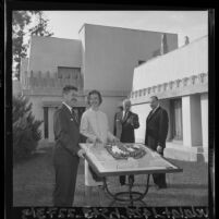 Paul Hunter, Paul R. Williams, Eunice Goodan and Herbert Kahn display model of Los Angeles Junior Arts Center at Hollyhock House, Los Angeles, 1965