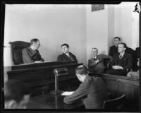 Football player Francis Tappaan on witness stand at inquest, 1933