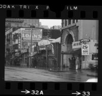 Pedestrians and storefronts along skid row at 200 block of E. 5th Street in Los Angeles, Calif., 1967