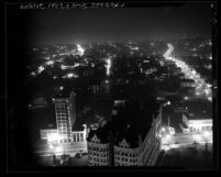 Nighttime cityscape seen from city hall tower looking west, during dim-out in Los Angeles, Calif., 1943