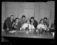 Seven actors and studio workers during telephone conference with A.F.L. officials in Los Angeles, Calif., 1946