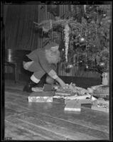 Irving Watcher dressed up as Santa Claus delivers gifts, Los Angeles, 1938