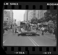 Magic Johnson and Pat Riley riding on float during parade celebrating the Los Angeles Lakers' 1982 Championship