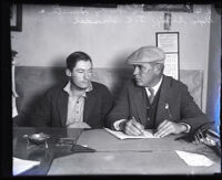 Arthur "Shorty" Smith being questioned by Deputy Sheriff Gilbert Blasdell, Los Angeles, 1925-1926