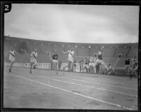 U.S.C. sprinter, Ed House, crosses the finish line in the 100-yard dash during a dual track meet versus Occidental, Los Angeles, 1926