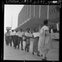 Los Angeles Biafra Student Association members, in native African garb, picketing the Los Angeles Federal Building, 1967