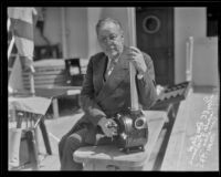 Leon F. Douglass poses with his submarine camera, Los Angeles, 1935