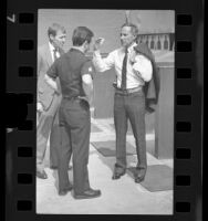 Police Chief Daryl F. Gates talking with officers in Los Angeles, Calif., 1988