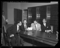Senator Joseph McCarthy seated with United States Attorney, Laughlin Waters, Roy M. Cohn, and G. David Schine, 1953