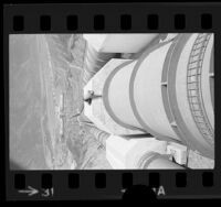 Worker inspecting 13-foot conduits at the Castaic Hydroelectric Power Plant, Calif., 1973