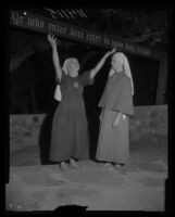 Bishop Nekona tells Sister Muriel of the fire that enveloped the Fountain of the World headquarters, 1958