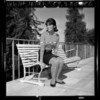 Female high school student modeling clothes that does not follow Los Angeles Unified School District's 1965 dress code