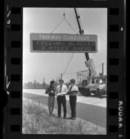Engineers testing electronic "Freeway Condition" alert sign in Los Angeles, Calif., 1972