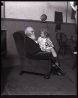 Cornelius Cole seated with child actor Richard Headrick, Los Angeles, 1920s