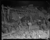 Workers going through the rubble of a ruined building after the Long Beach earthquake, Southern California, 1933