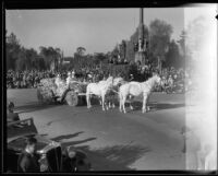 Mary Pickford, Grand Marshal of the Tournament of Roses Parade, in a flower-covered coach, Pasadena, 1933