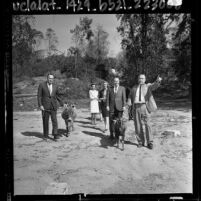 Mayor Samuel W. Yorty with five people inspecting site of the future Children's Zoo in Griffith Park, Calif., 1964