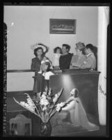 Retiring pastor of Filipino Christian Church having his children christened by his successor in Los Angeles, Calif. 1946