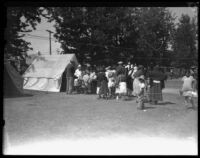 Displaced families in line for medical assistance after the failure of the Saint Francis Dam and resulting flood, Santa Clara River Valley (Calif.), 1928