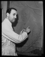 Carmelo Barbera working on a relief sculpture of Thomas Edison, Los Angeles, 1933