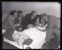 Winnie Ruth Judd, murder suspect, with husband Dr. W. C. Judd and reporters at the Georgia Street Receiving Hospital, Los Angeles, 1931