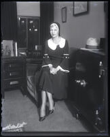 Daisy De Voe seated in attorney Nathan Freedman's office, Los Angeles, 1931