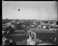 Scores of cars stop at the convergence of Vermont and Nomandie Avenues for the dedication ceremony of the new thoroughfare, Los Angeles, 1932