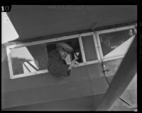 Chief investigator George Contreras, seated in a biplane on his way to Oregon during the hunt for kidnapper and murderer William Edward Hickman, Los Angeles, 1927