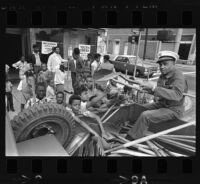 Distributing street cleaning supplies to Operation Youth in Los Angeles (Calif.)