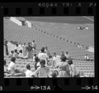 Confrontation between a white youth and group of African Americans during 1966 Teen Post Junior Olympics in Los Angeles, Calif