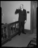 William H. Neblett, standing in a courtroom, Los Angeles, 1932 — Calisphere
