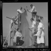 Two instructors teaching four Peace Corps trainees carpentry at California State College, Los Angeles, 1964