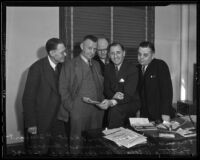 Percy V. Hammon, Robert P. Stewart, Eugene Williams, and Willard W. Burgess congratulate Buron Fitts on trial success, Los Angeles, 1936