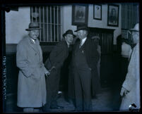 Bootlegger "Socks" McDonald in handcuffs in jail, Los Angeles, 1931