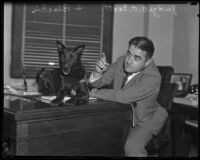 Judge A. A. Scott with canine witness, Blackie, in his office, Los Angeles, 1935