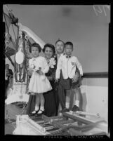 California Institute of Technology scientist, Dr. Hsue-shen Tsien with his family onboard SS President Cleveland, Los Angeles, 1955