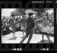 Dancers on Olvera Street performing for minibus crowd in Los Angeles, 1972