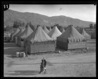 Two women and a child in a relief camp for flood victims following the failure of the Saint Francis Dam, Santa Clara River Valley (Calif.), 1928