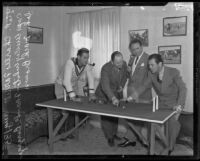 Captain Wesley White demonstrates polo strategies to Charlie Farrell, Frank Borzage, and Johnny Mack Brown, Los Angeles, 1935