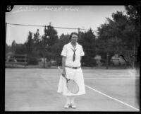 Marion Williams standing with tennis racket, Midwick Country Club, Alhambra, 1925