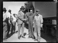 Crown Prince Gustav Adolf of Sweden shaking the hand of the engineer of his train, [Los Angeles?], 1926