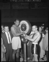 Sugar Ray Robinson and Carl (Bobo) Olson weigh in